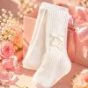 White vertical striped socks with double bow decorations Specification image
